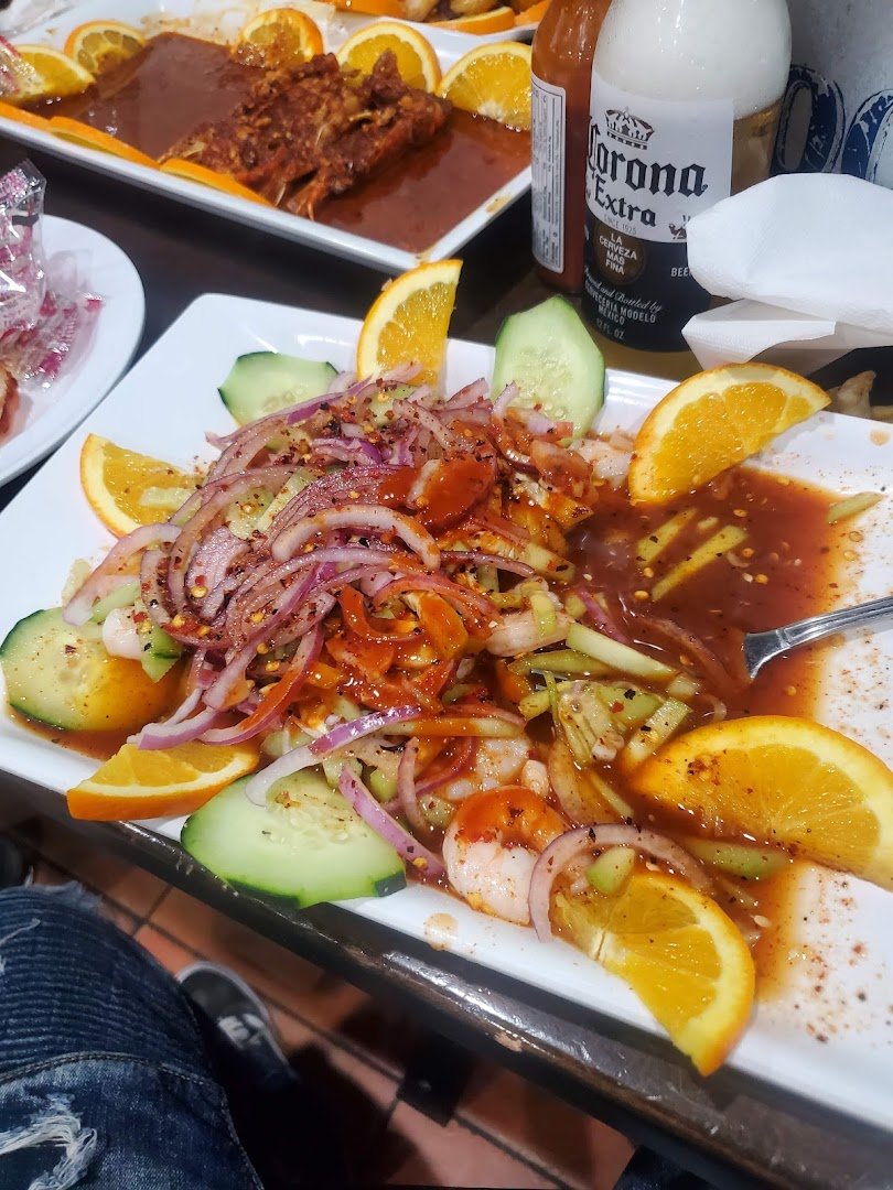 Colorful Mexican dishes on a casual restaurant table.